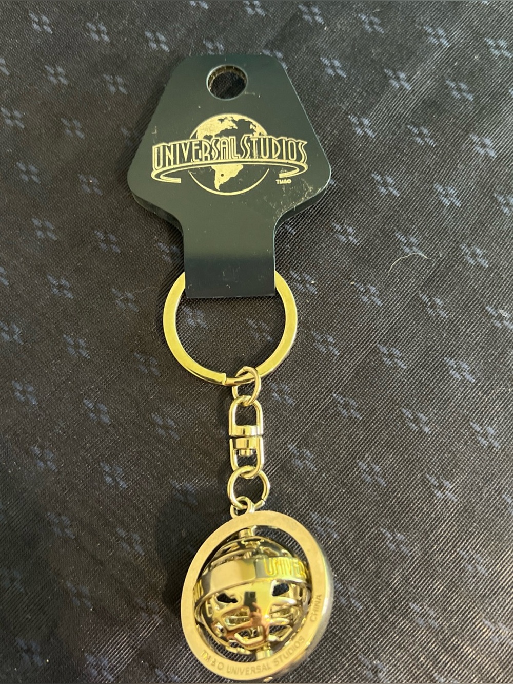 Universal Studios Silver Tone Spinning Globe Metal Keychain
